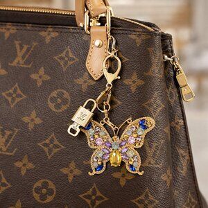 Authentic Louis Vuitton Gold Padlock & Key with Unbranded Butterfly Keychain